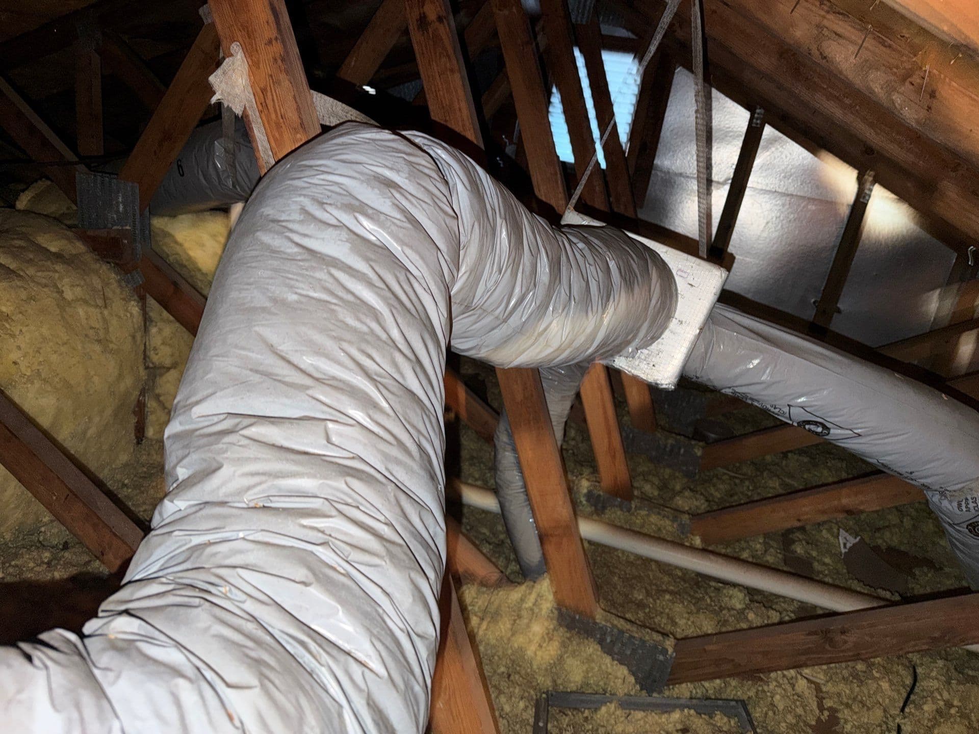 Protek technician performing duct replacement at a Tampa FL home - Protek Heating & Cooling