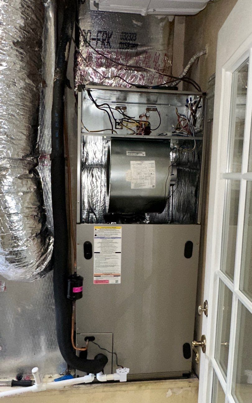 New vertical air handler installed in a closet in a New Tampa home