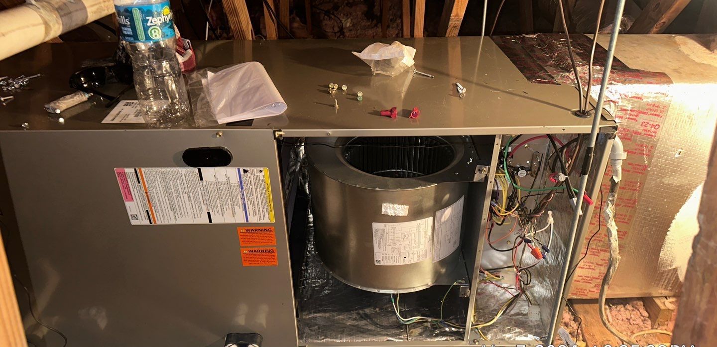 New variable-speed air handler set on the attic platform during installation