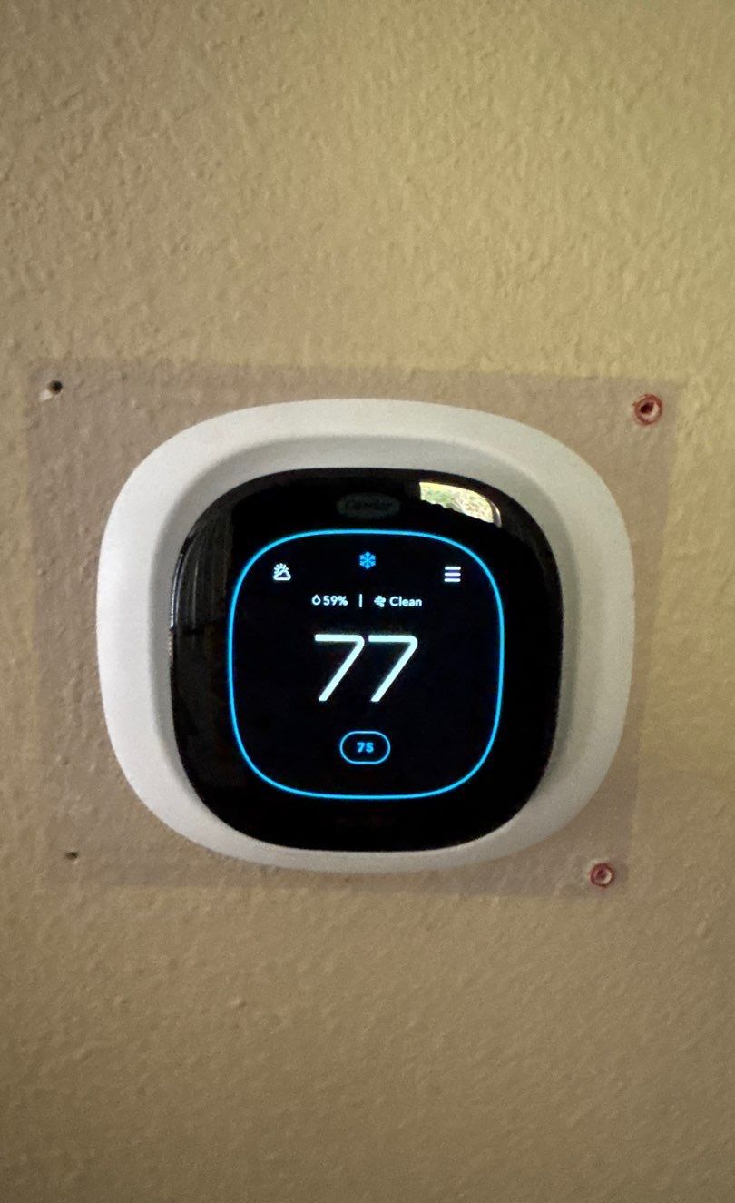 New smart thermostat installed on the wall