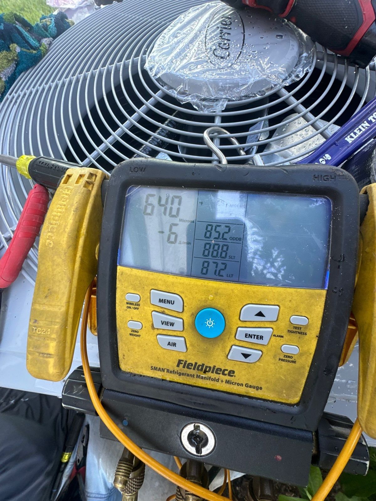 Digital refrigerant gauges on a new heat pump during startup