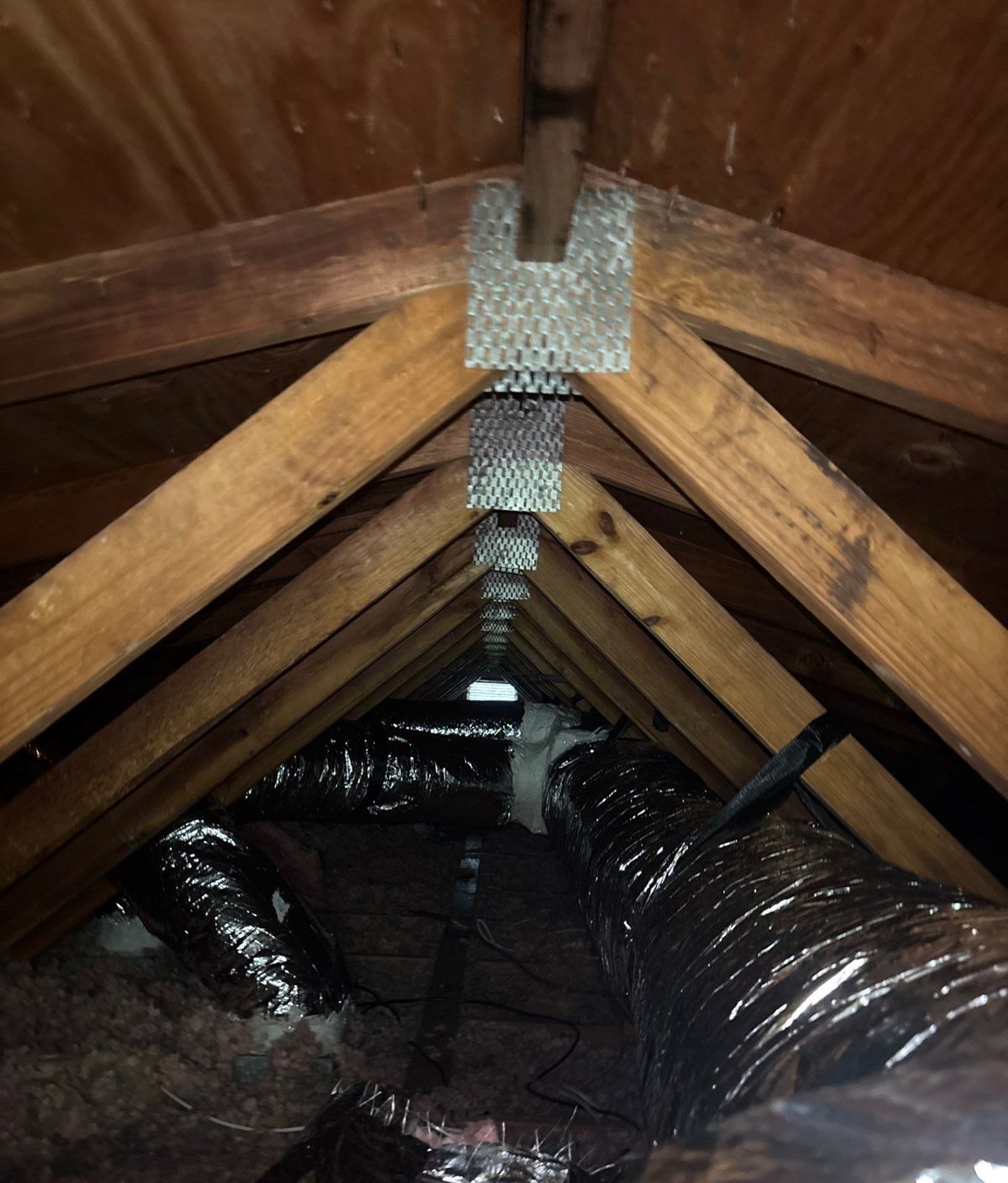 New insulated flex duct runs in a Lutz, FL attic after replacement