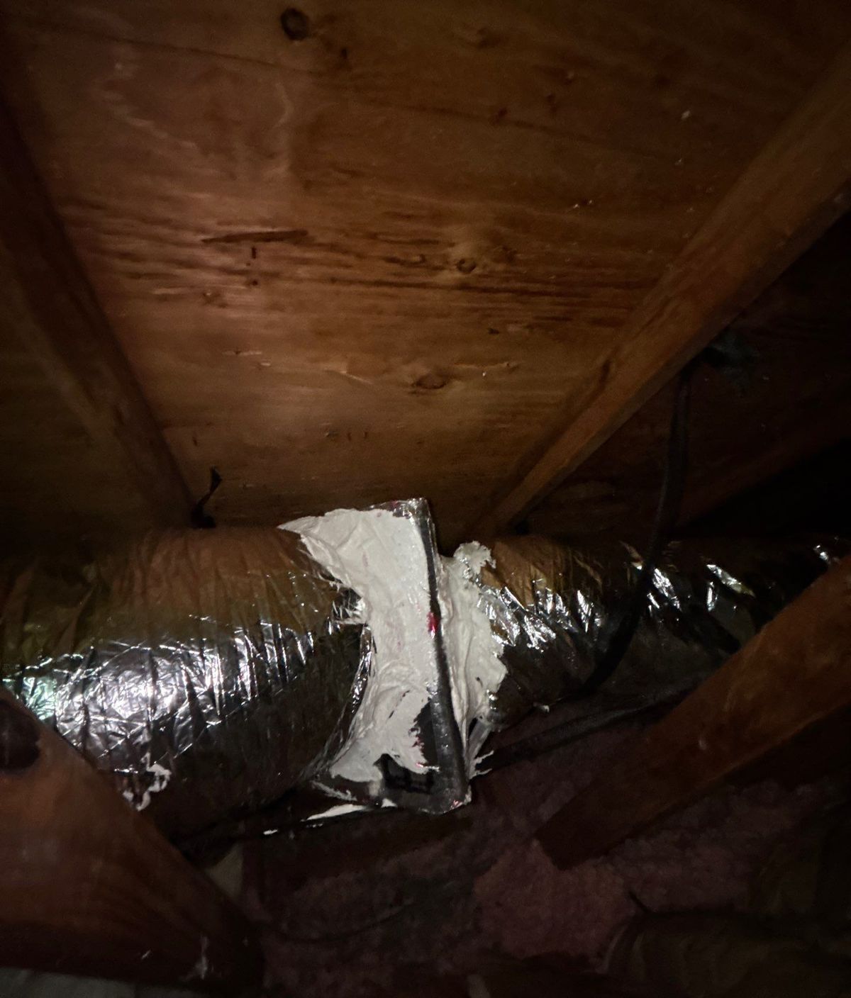 New flex duct connection in the attic after duct replacement