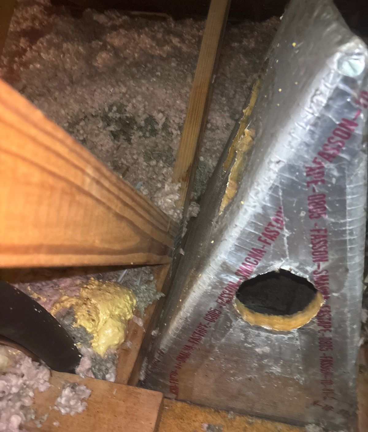 Worn old duct board at the trunk of the existing duct system