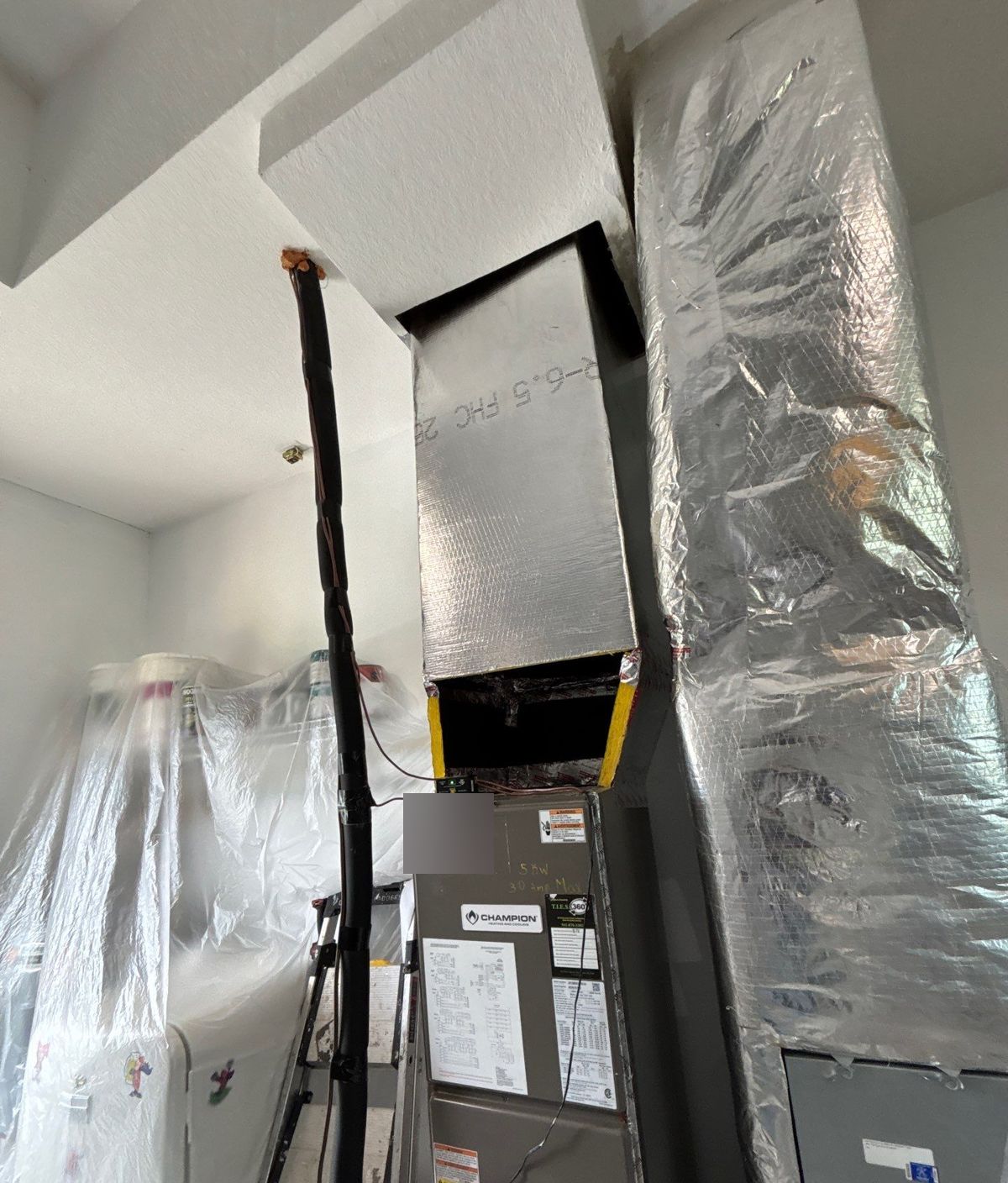 New duct board plenum on top of the air handler after duct replacement in Ruskin