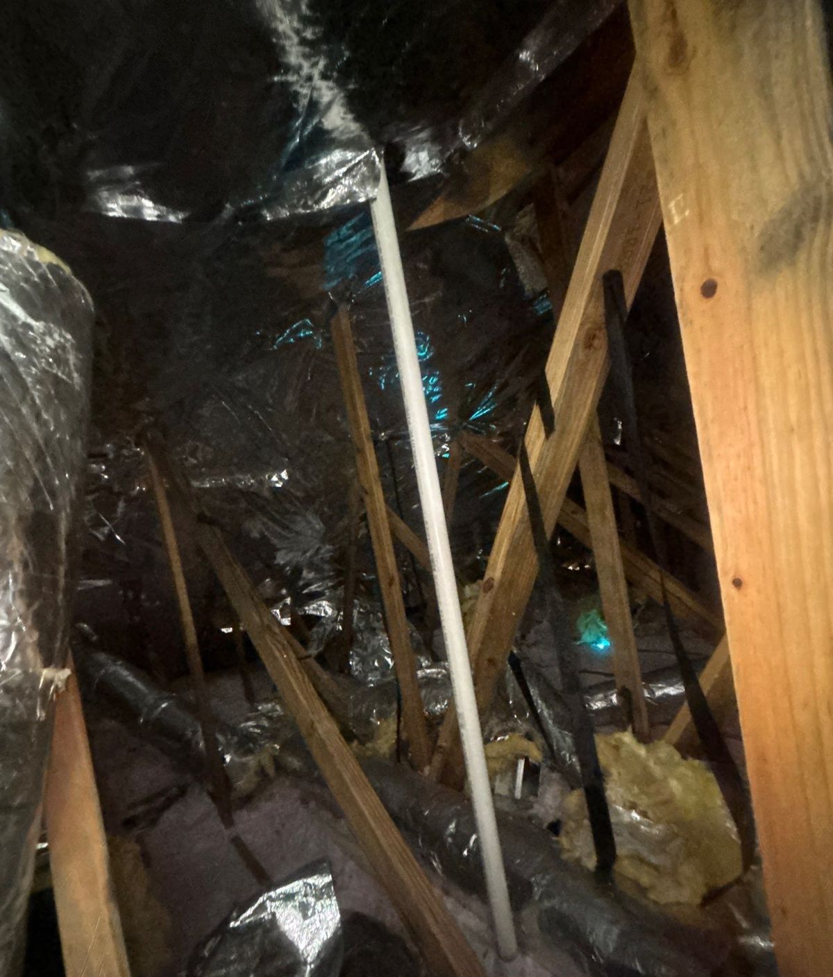 Old metal supply ductwork in the attic of a Ruskin, FL home before replacement