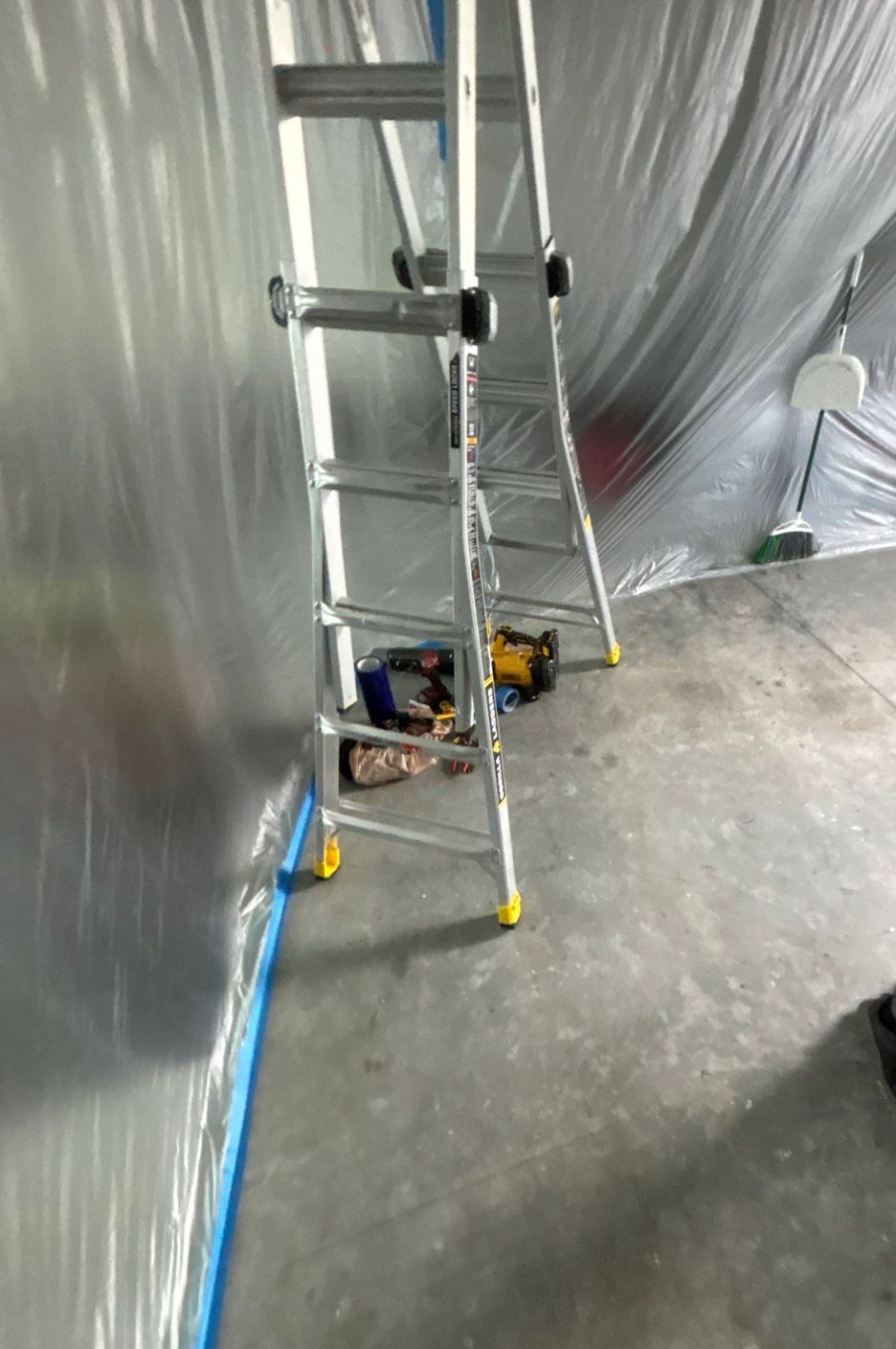 Plastic sheeting containment set up inside a Ruskin home during duct replacement