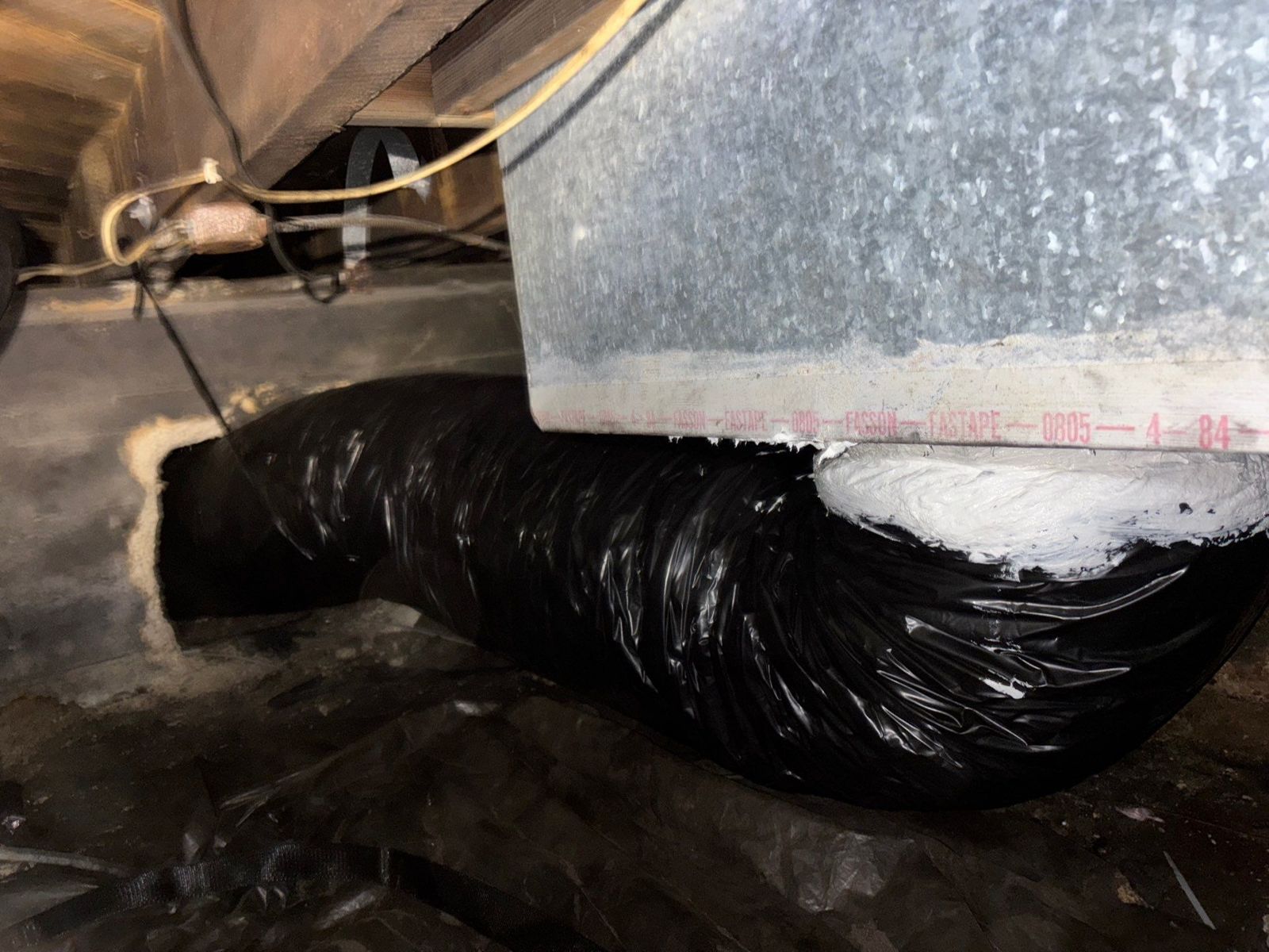 New flex duct sealed to a sheet metal plenum under a raised home