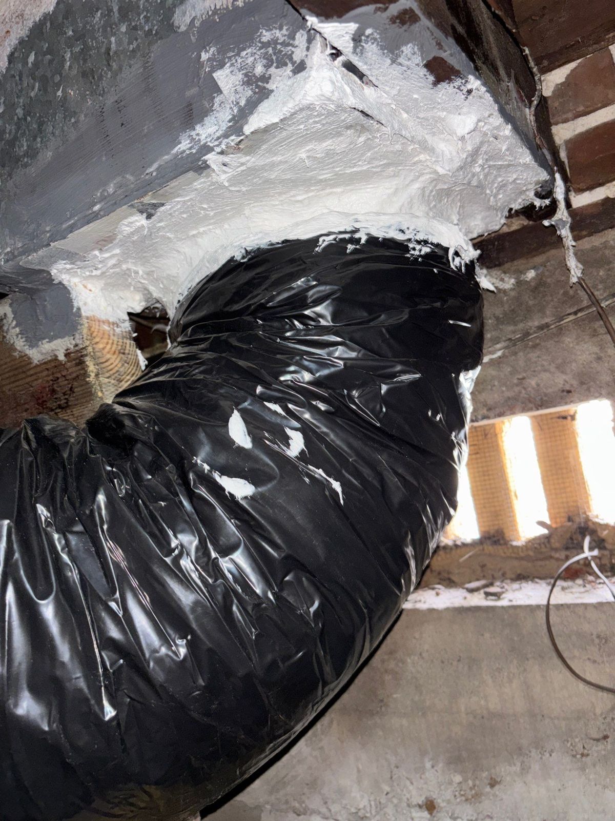 New insulated flex duct connected to a mastic-sealed plenum