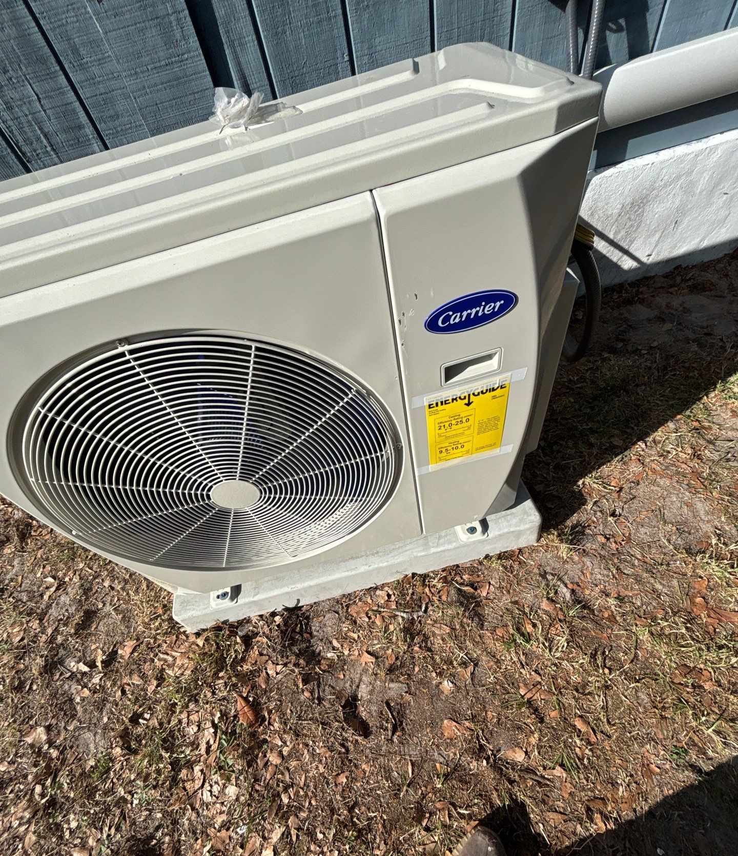 Close-up of the new ductless mini-split outdoor unit after installation