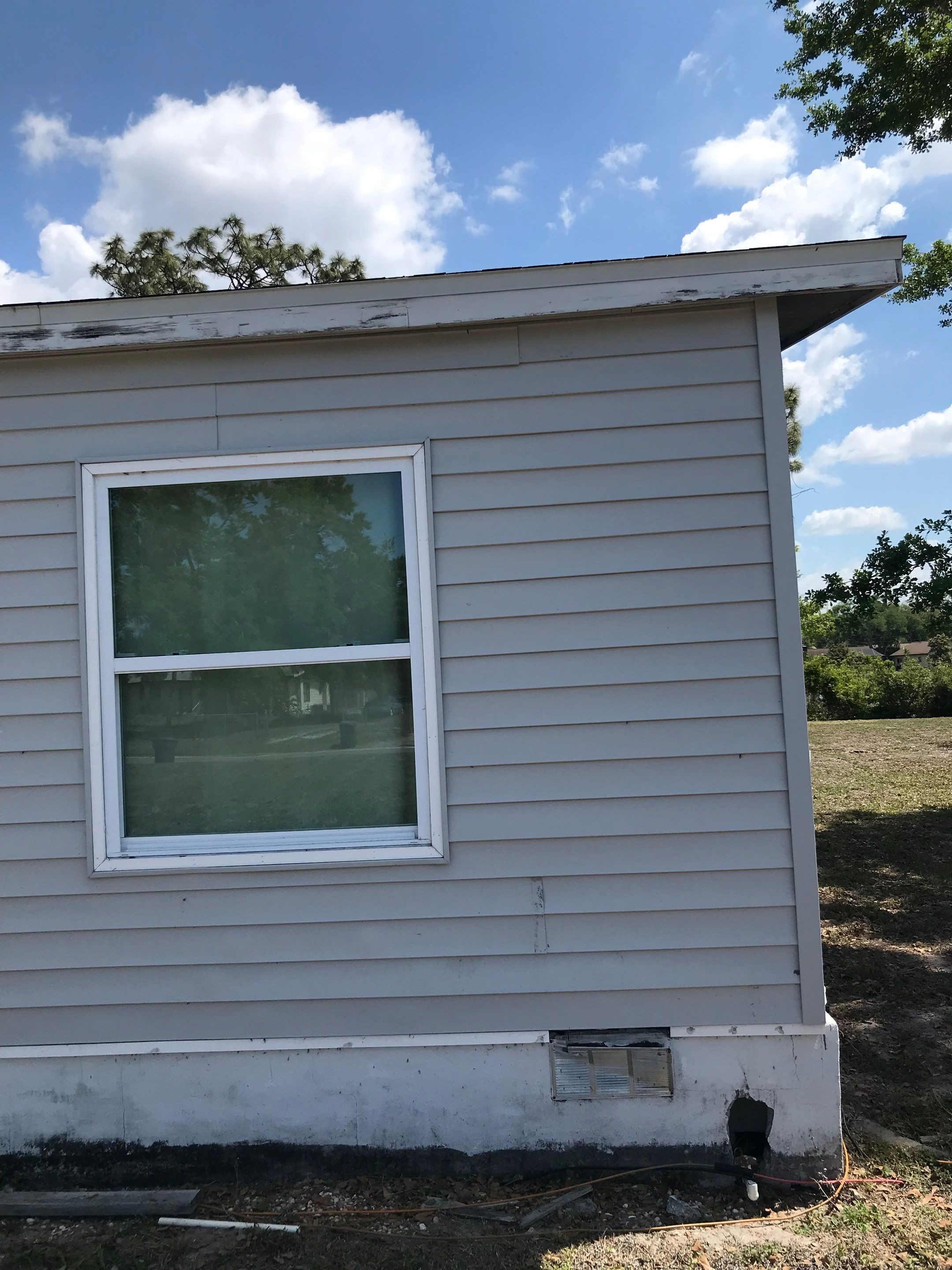 End wall of a Riverview home before ductless mini-split installation