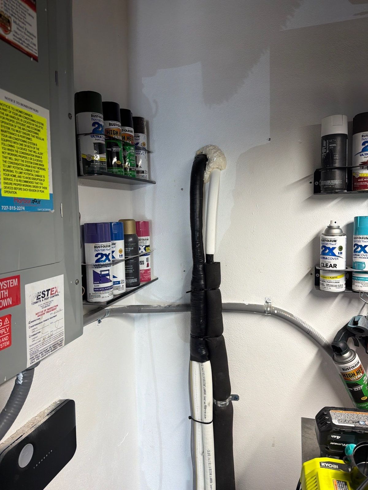 PVC condensate line run through a garage after mini-split replacement