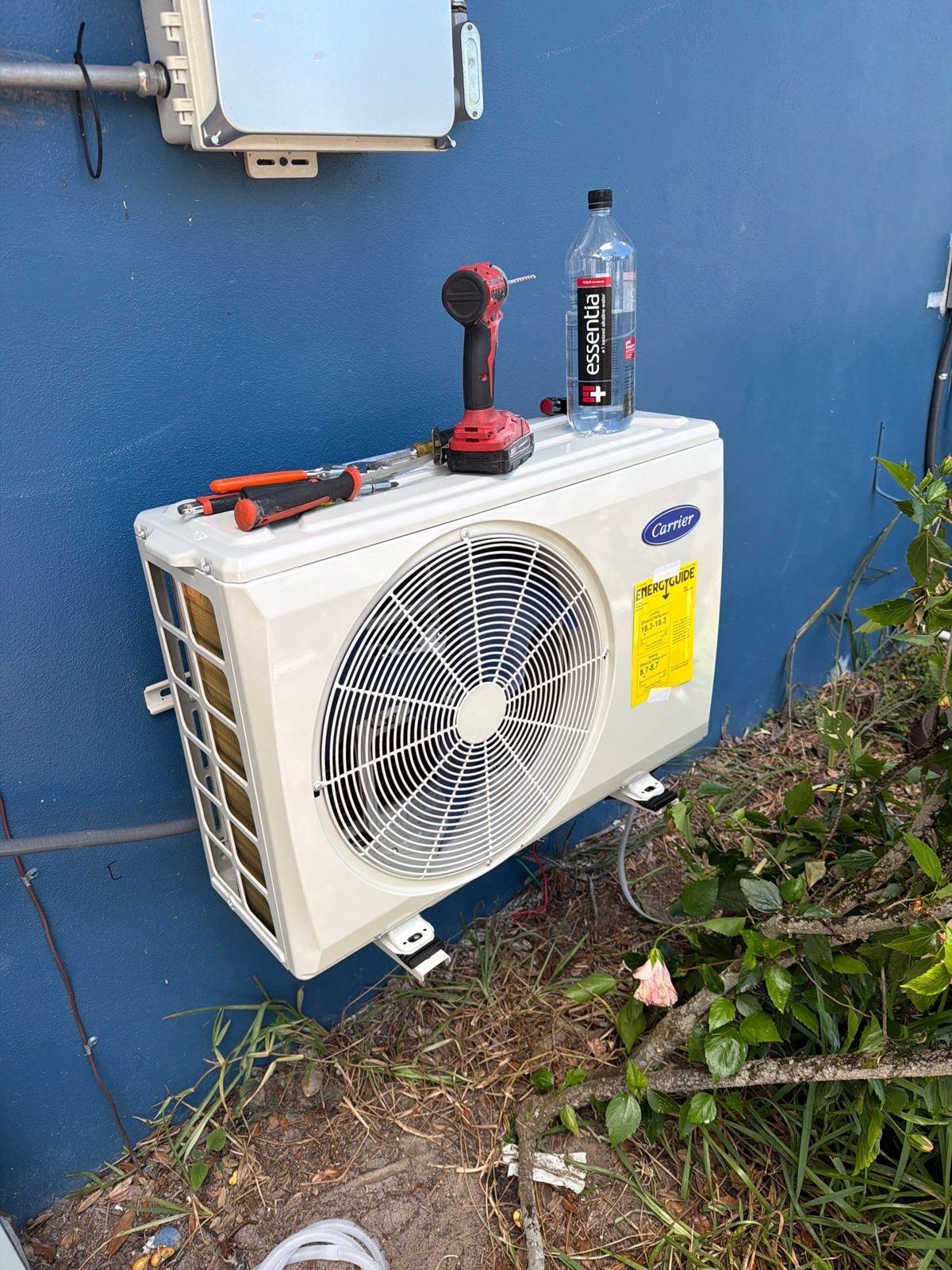 New mini-split outdoor unit mounted on the existing wall bracket