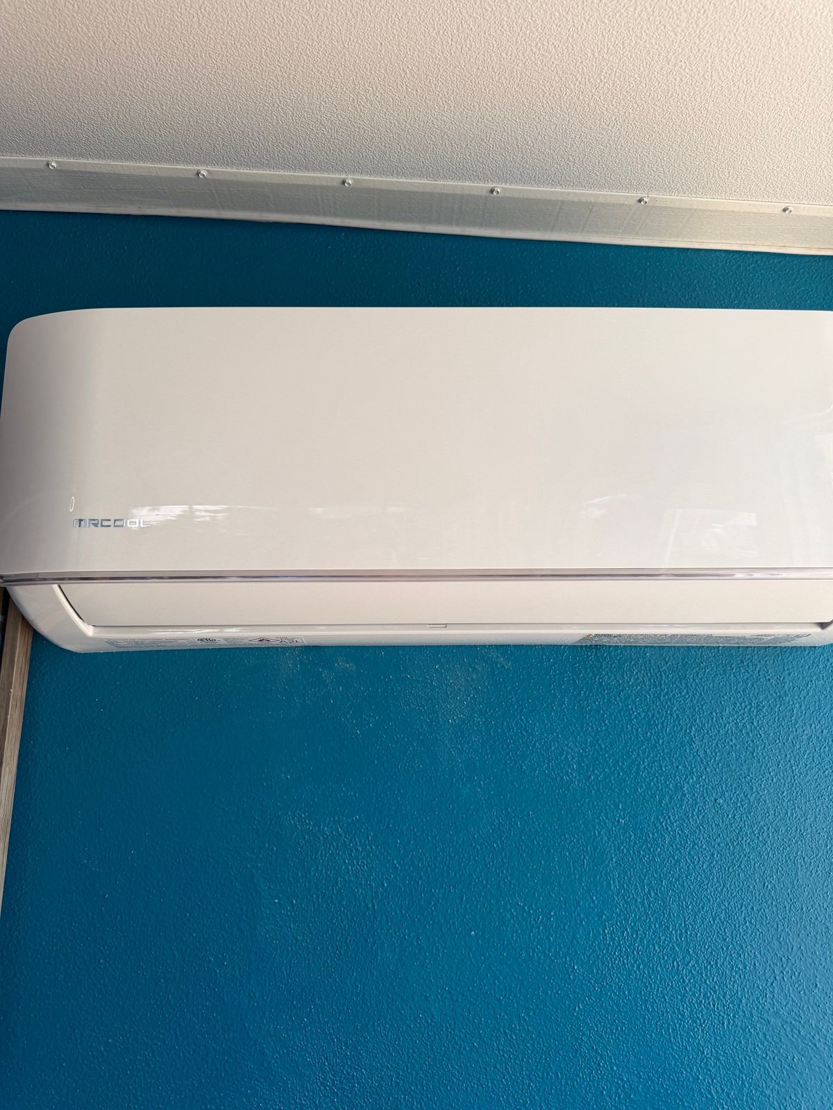 Old ductless mini-split indoor head on the wall of a Clearwater, FL home