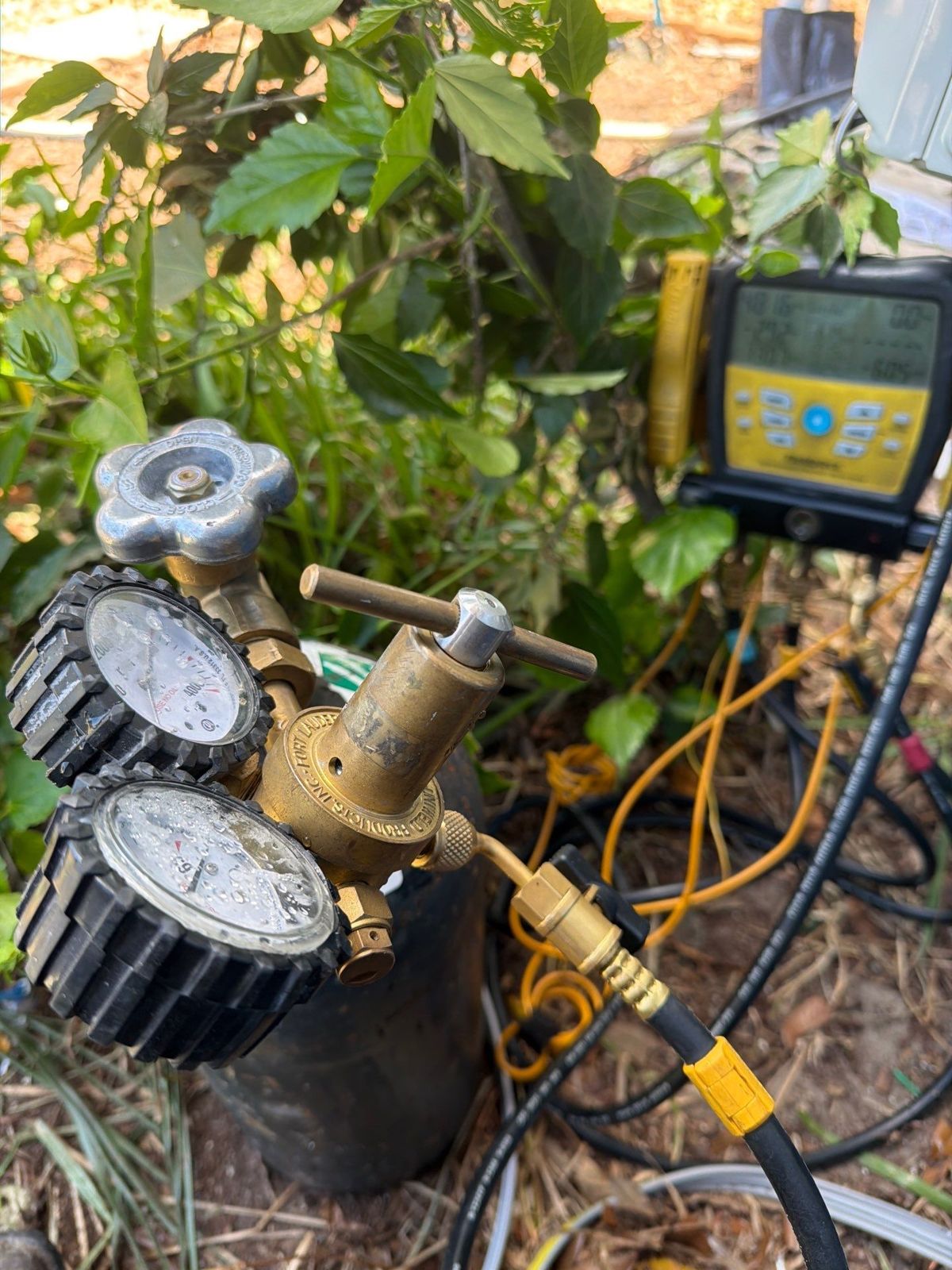 Manifold gauges connected during mini-split startup in Clearwater