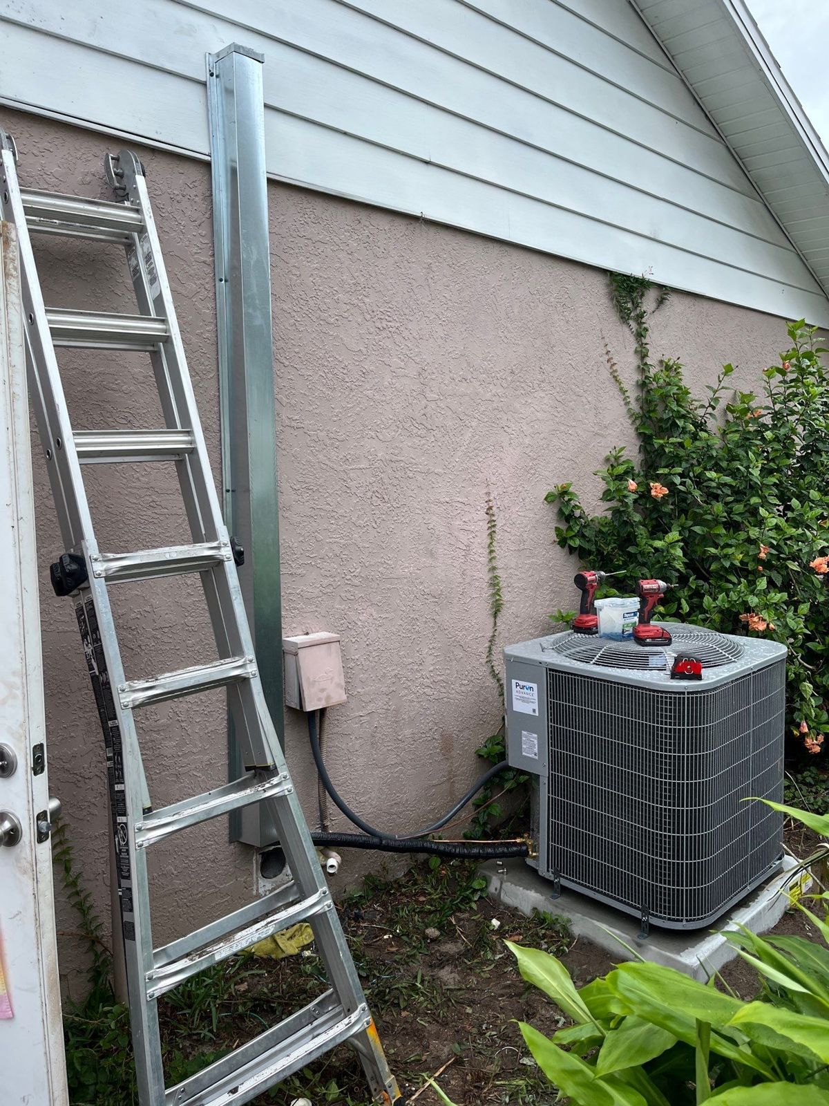 New heat pump outdoor unit beside a Zephyrhills home