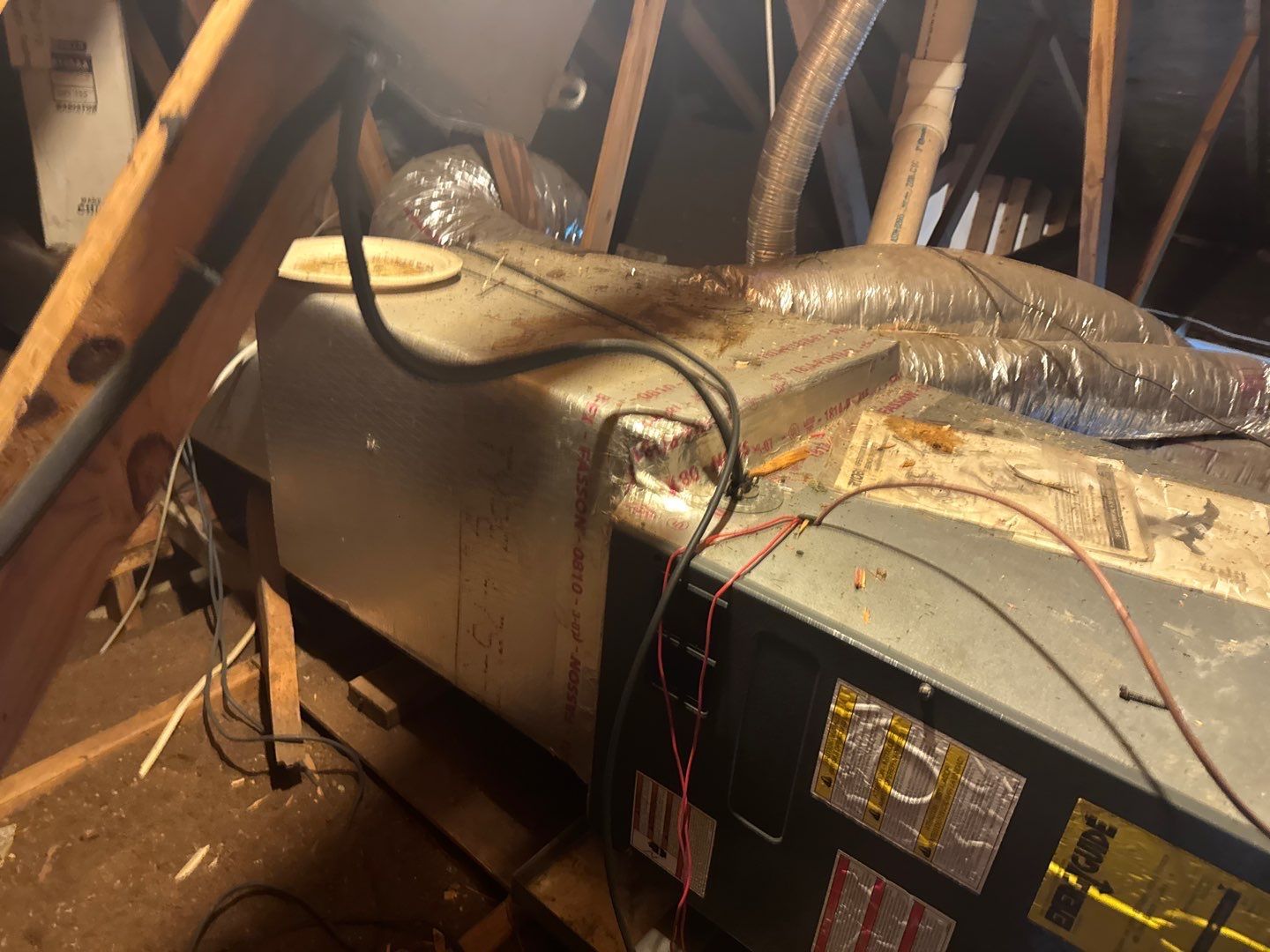 Old horizontal air handler in the attic before replacement