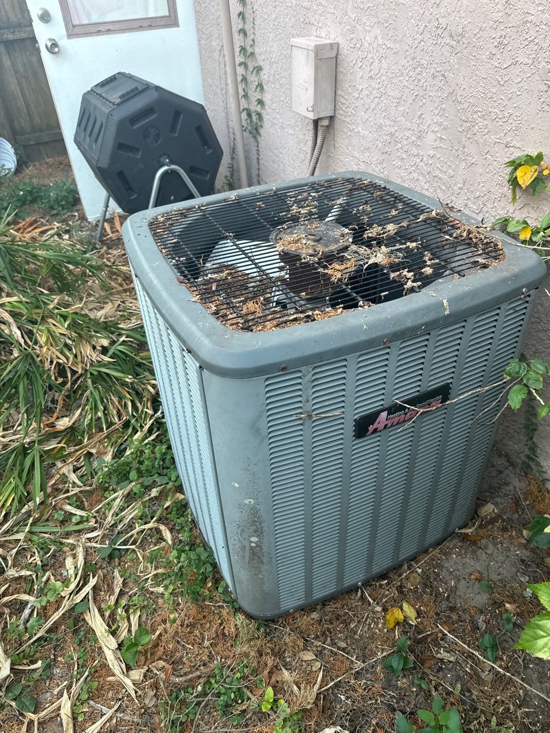 Rusted old outdoor unit full of debris before replacement in Zephyrhills, FL