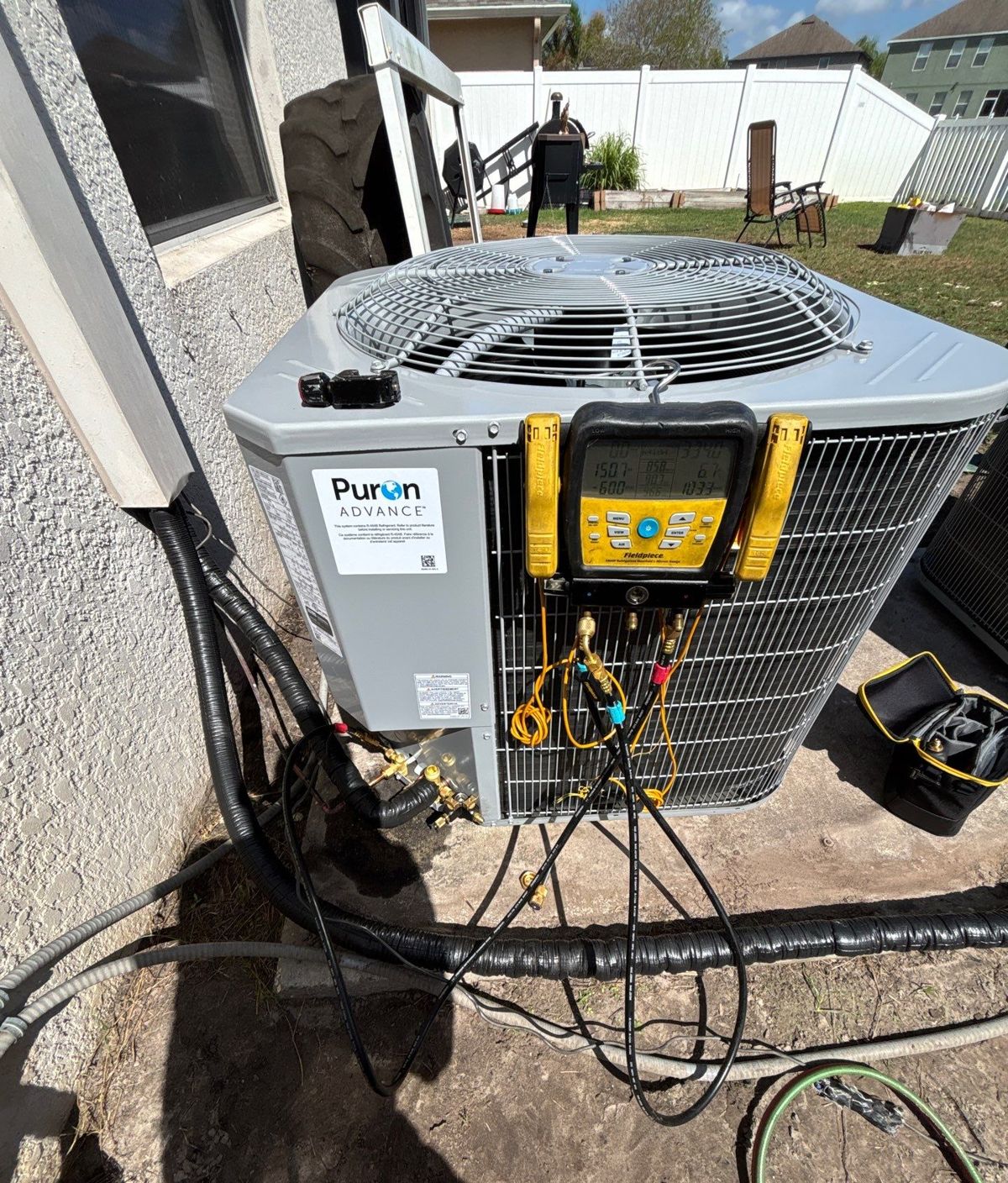 New heat pump outdoor unit on gauges at startup in Land O' Lakes, FL