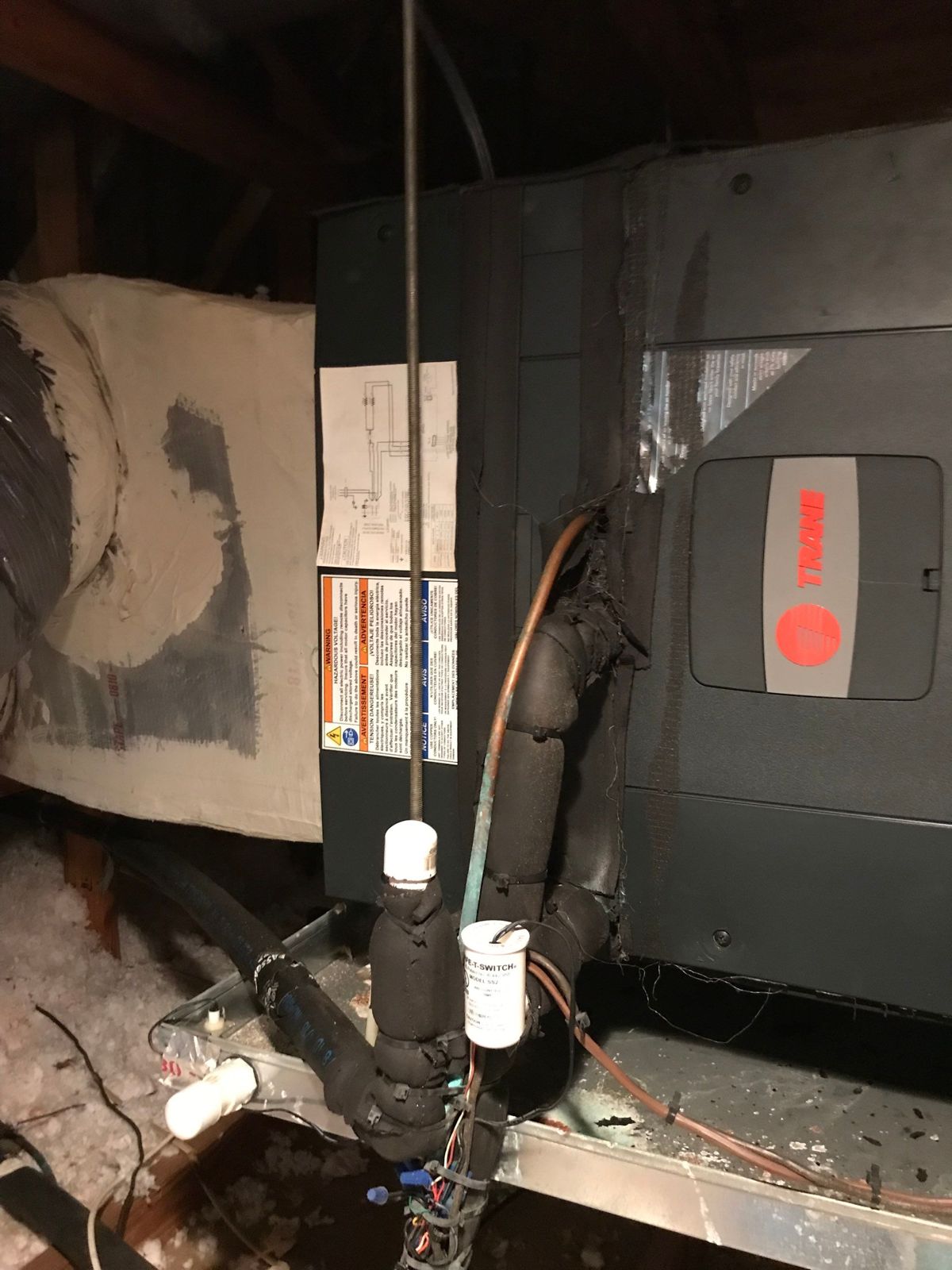 Old air handler drain connections in a New Tampa attic