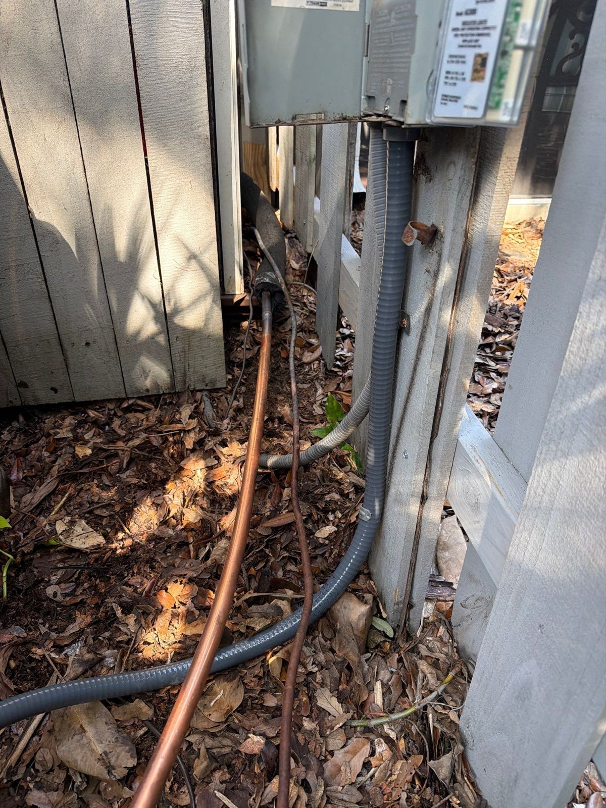 New electrical whips and line set at the outdoor unit location