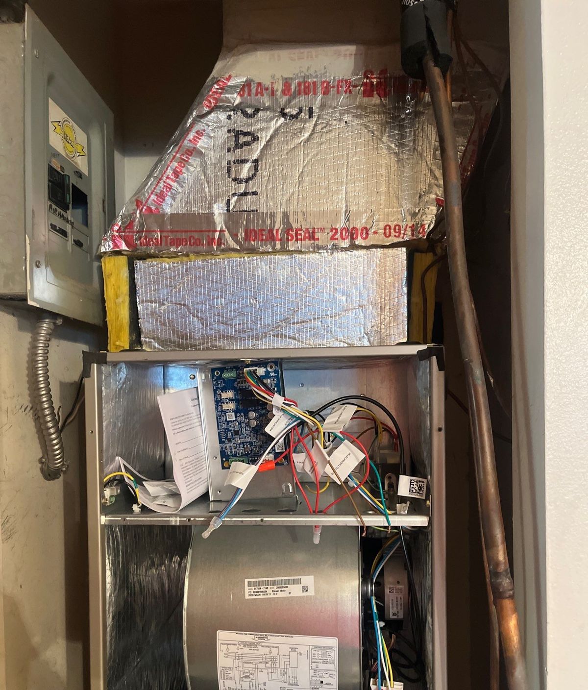 Air handler opened up in a hall closet during heat pump replacement